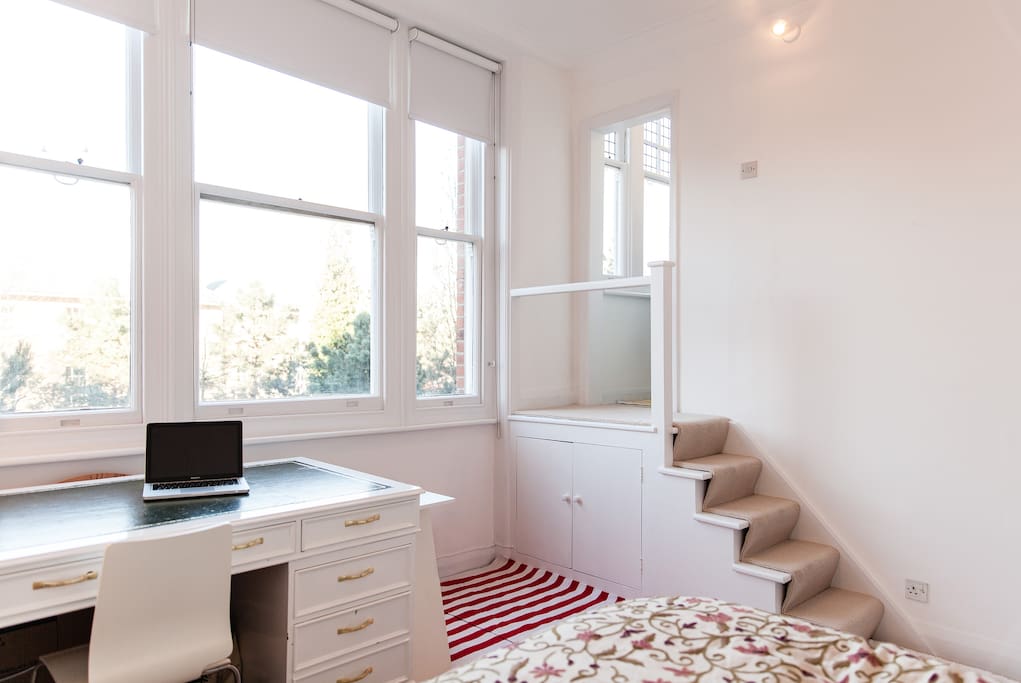 Such a bright and peaceful apartment with wonderful views over a private garden