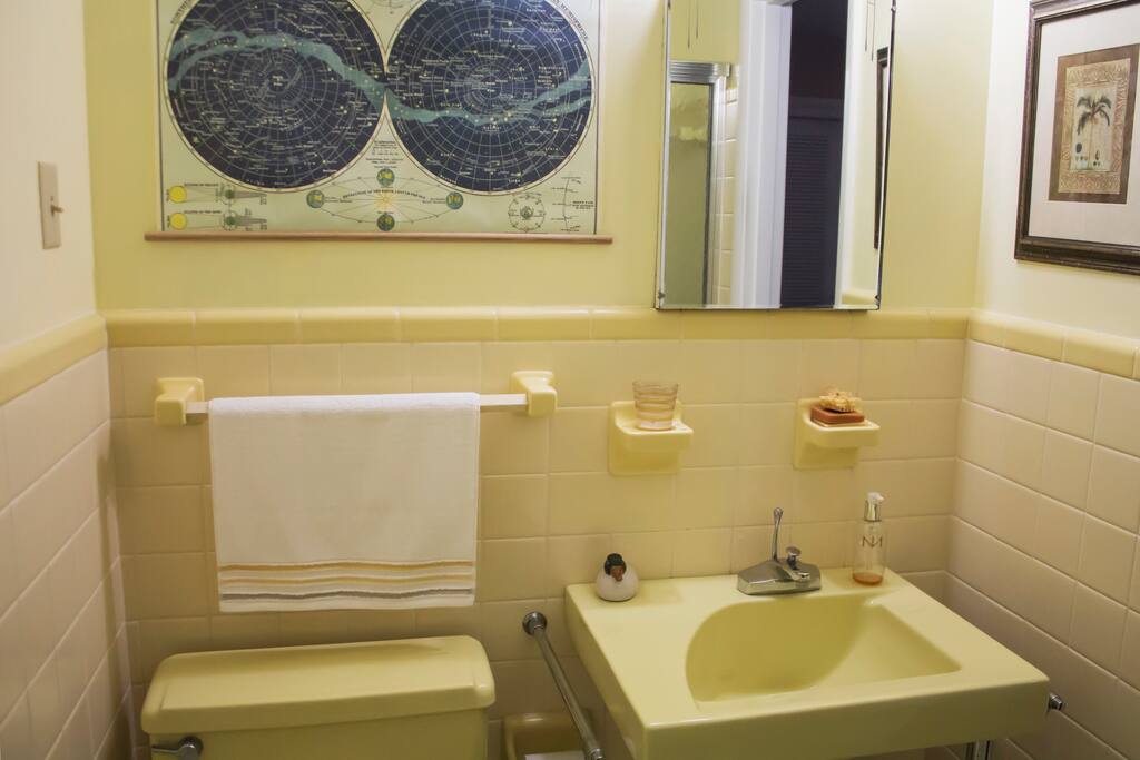 Sunny retro private bathroom connected to your cozy quarters.