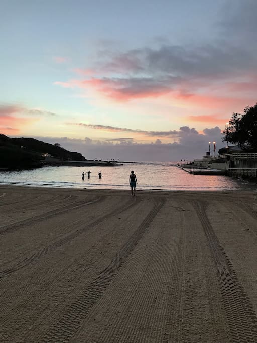 Sunrise and swimmers at Clovelly Beach