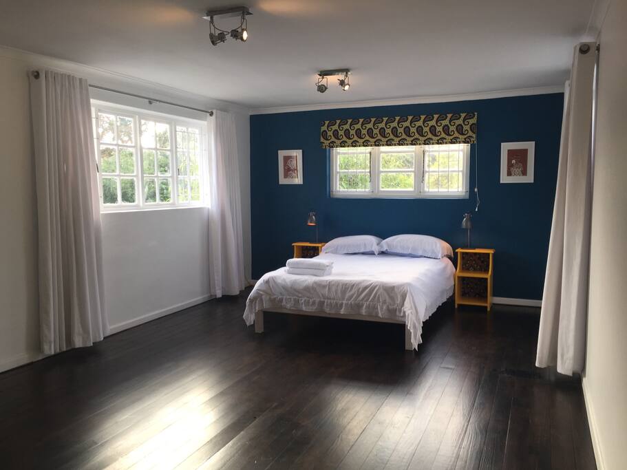 The bedroom is super spacious and the three windows let in lots of light