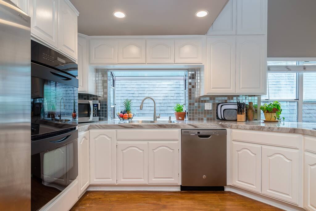 Kitchen with new Dishwasher and plenty of space for storage in cabinets