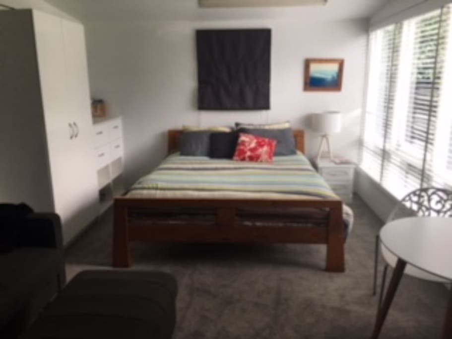 Comfortable bed, large wardrobe and sunny room