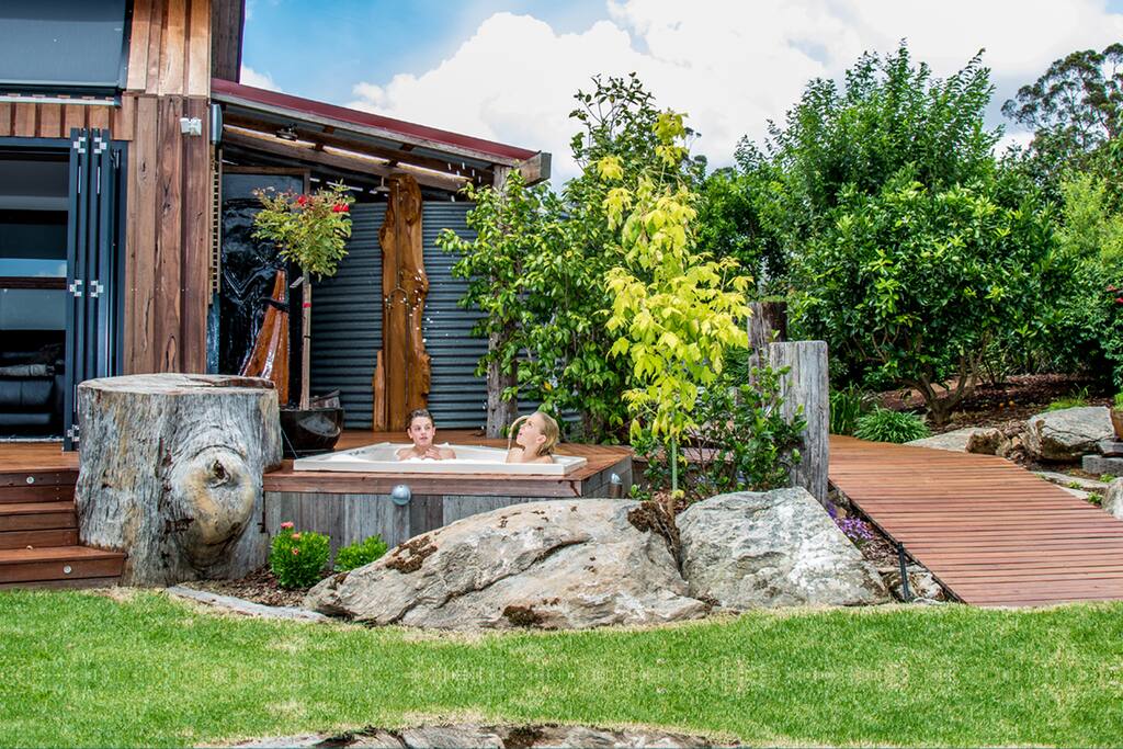 Relax in the spa on the deck looking over the Karri forest