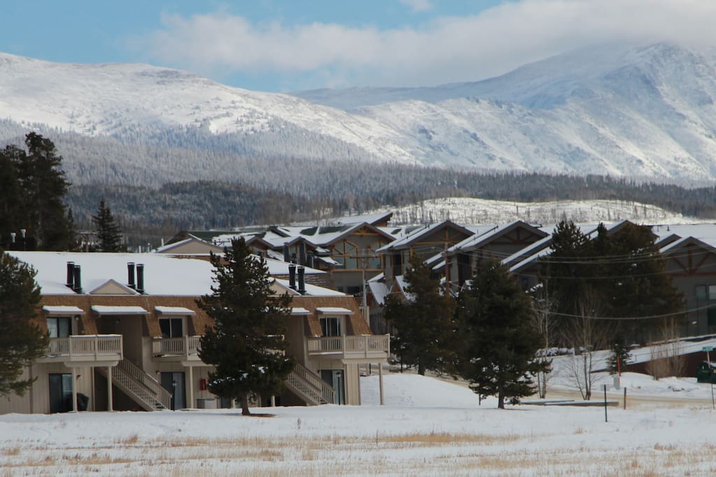 Ground floor condo on the lower left, surrounded by beautiful mountains