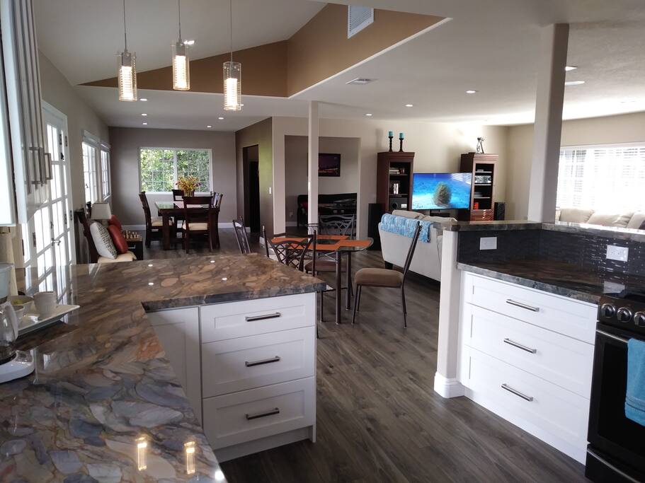 All New Kitchen with Quartzite Countertops and Black Stainless steel Appliances
