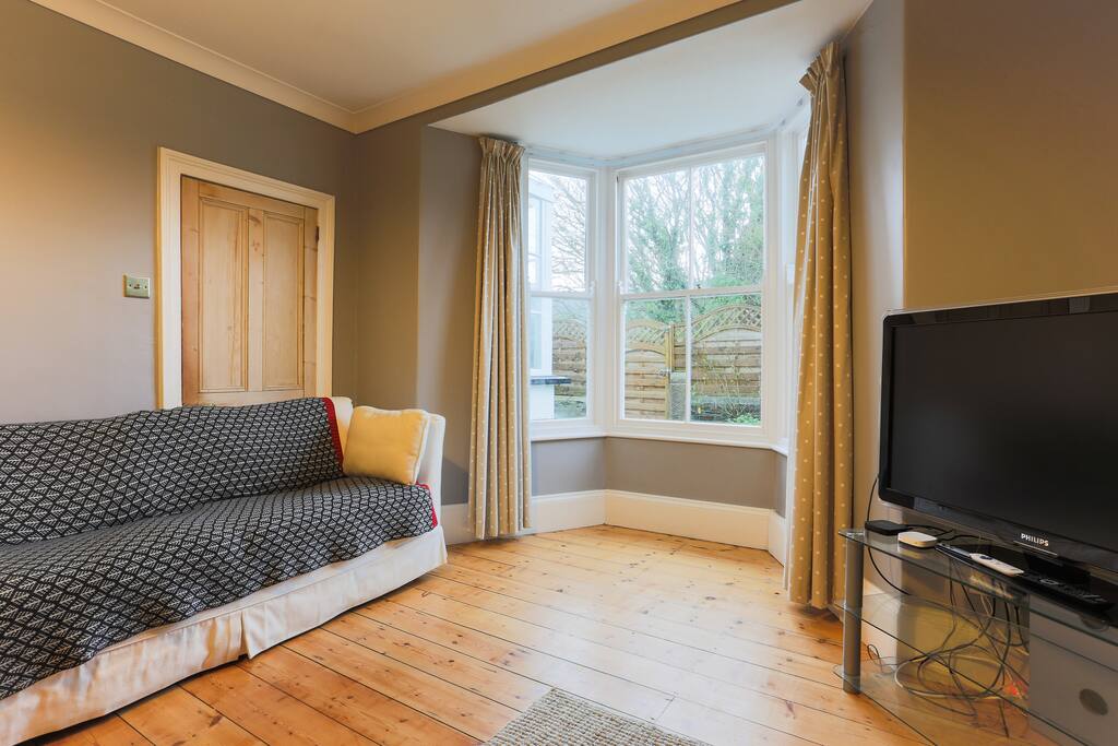 Large screen television, apple tv, two large 3 seater sofas