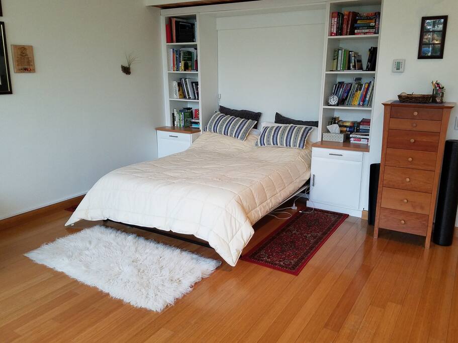 Queen bed facing the river.