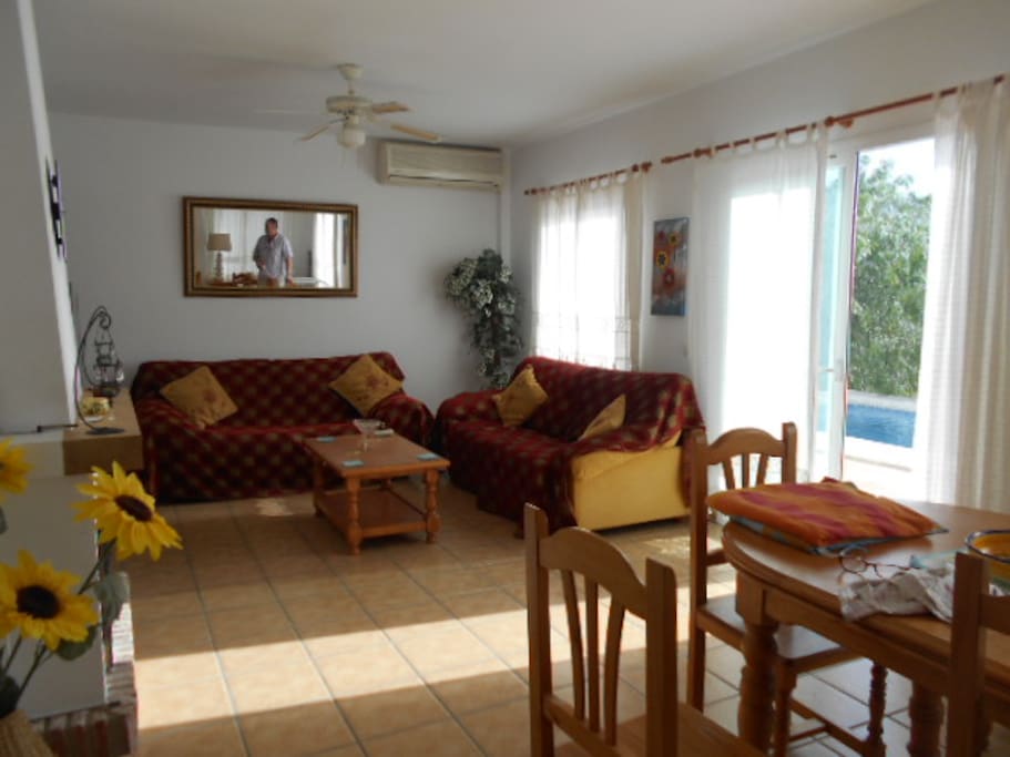 lounge/diner with patio doors to the pool and terrace