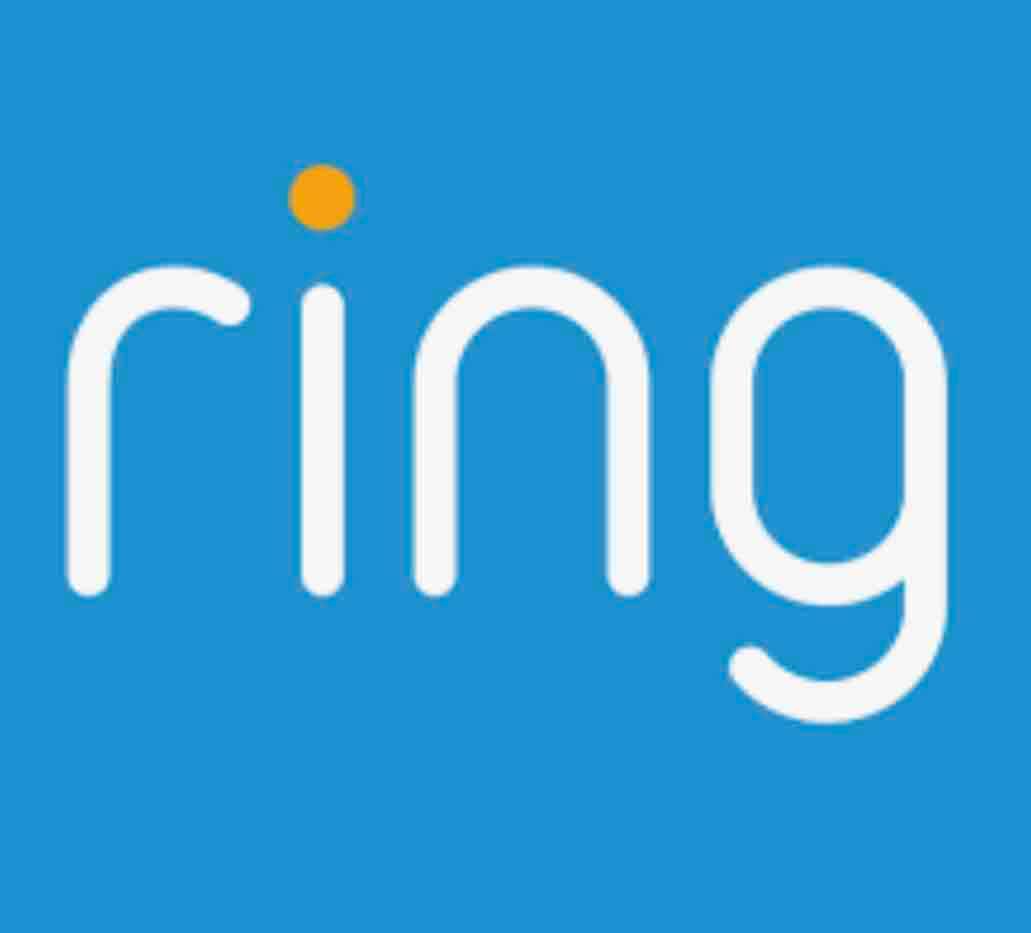 The Ring security system logo is displayed on a blue background. The logo features a simple, modern font with a small orange dot above the 'i', emphasizing the brand's focus on home security and technology.