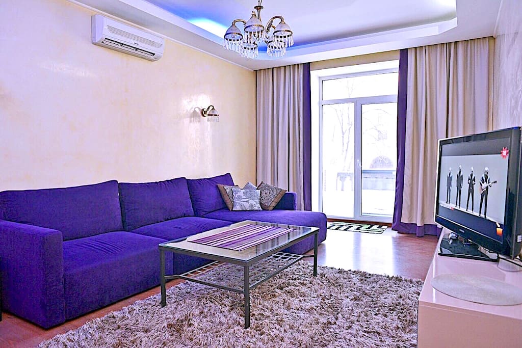 Spacious living room with access to the terrace, overlooking the main street Kreschatik and Independence Square.