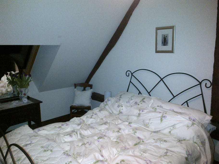 The White Room, on the first floor with space for a cot or single beds for a family. Bathroom adjacent.