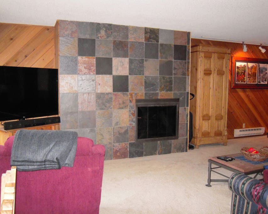 Snugly warm gas fireplace and flat-screen TV. TV includes a Roku player & DVD player