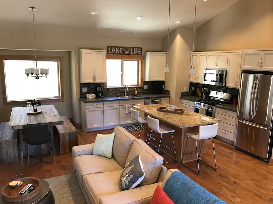 Main living area upstairs. Dining table seats 6-8 with 3 at the island.