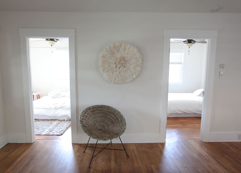 Two main bedrooms both have ceiling fans, queen beds and private entrances.