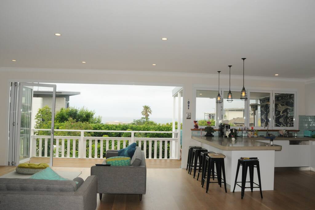 Bi fold doors open seamlessly to deck. Stunning water views