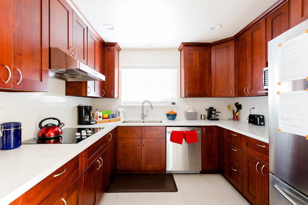 Dual sink kitchen, coffee maker and coffees and teas selection.