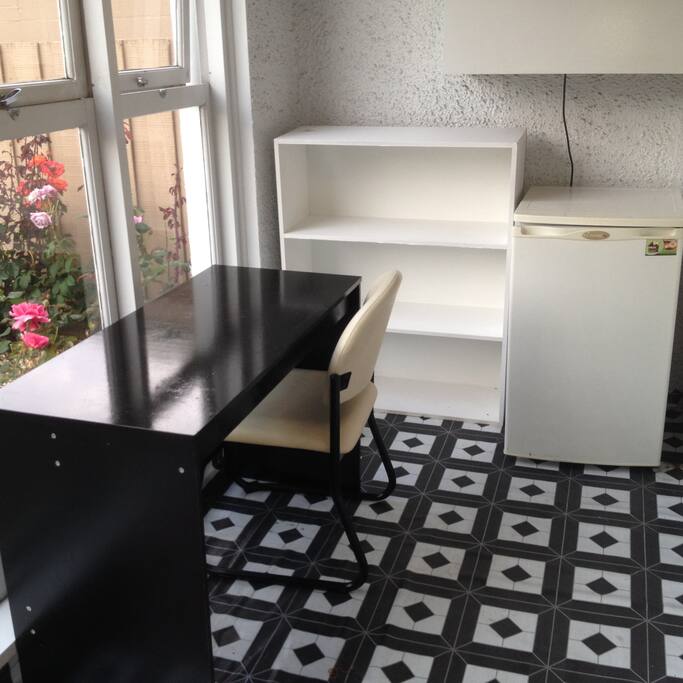 Entrance porch with facilities for cuppa, eating, reading etc overlooking street.