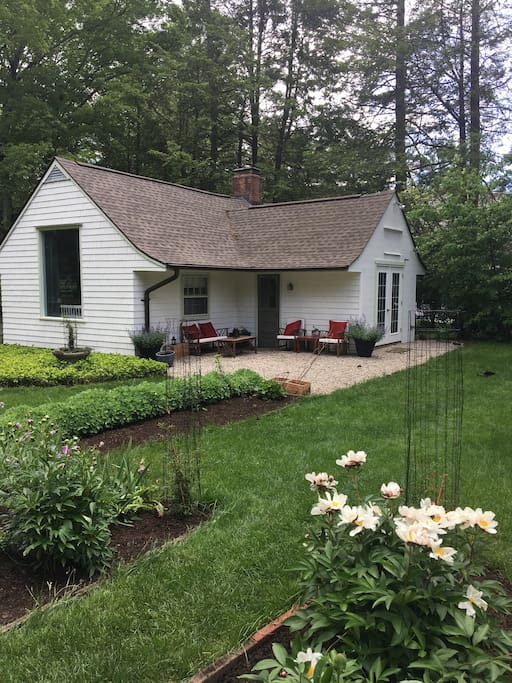 View of cottage with outdoor seating area