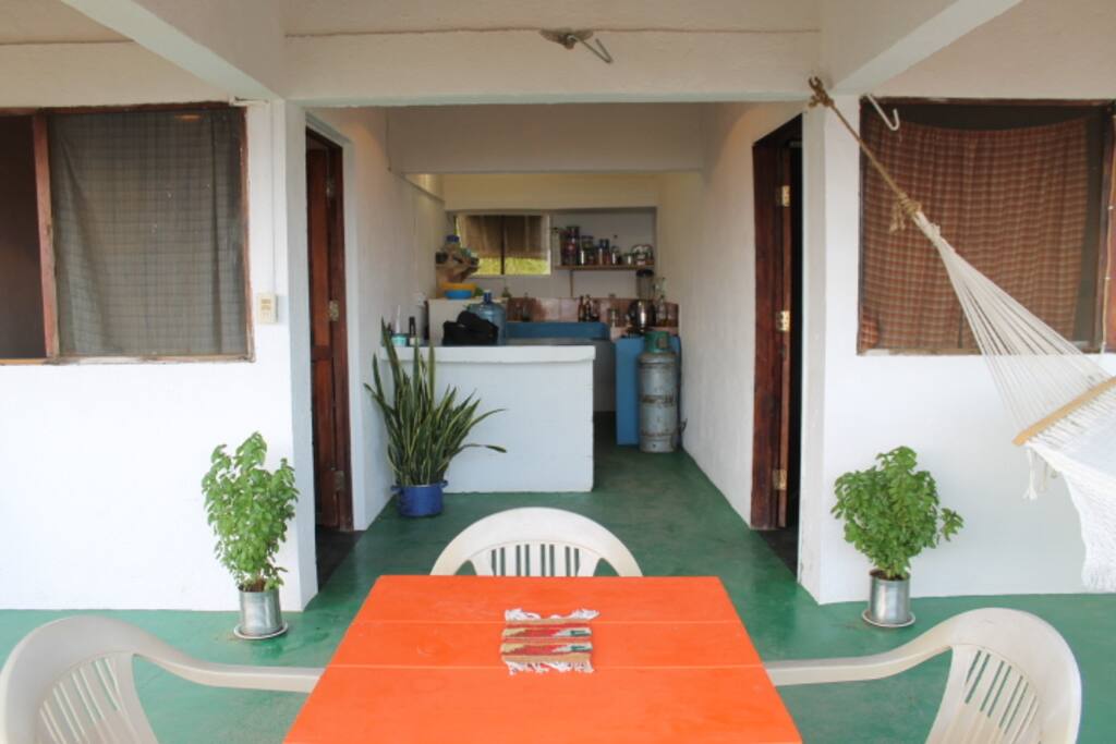 View looking into the kitchen with the bedrooms on either side of the kitchen