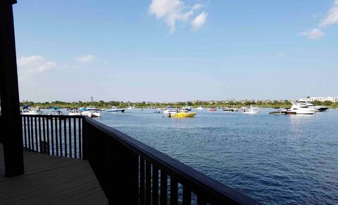 Waterfront by Nassau Bay’s popular party cove.