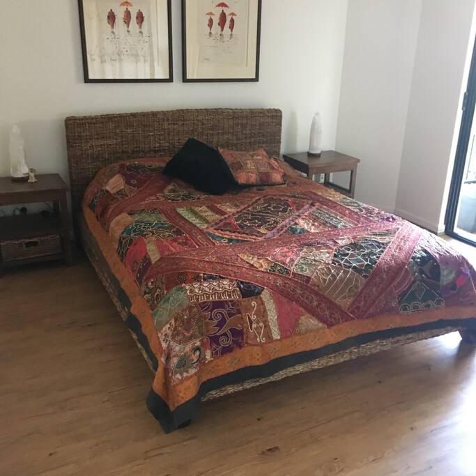Queen sized bed listening to the ocean