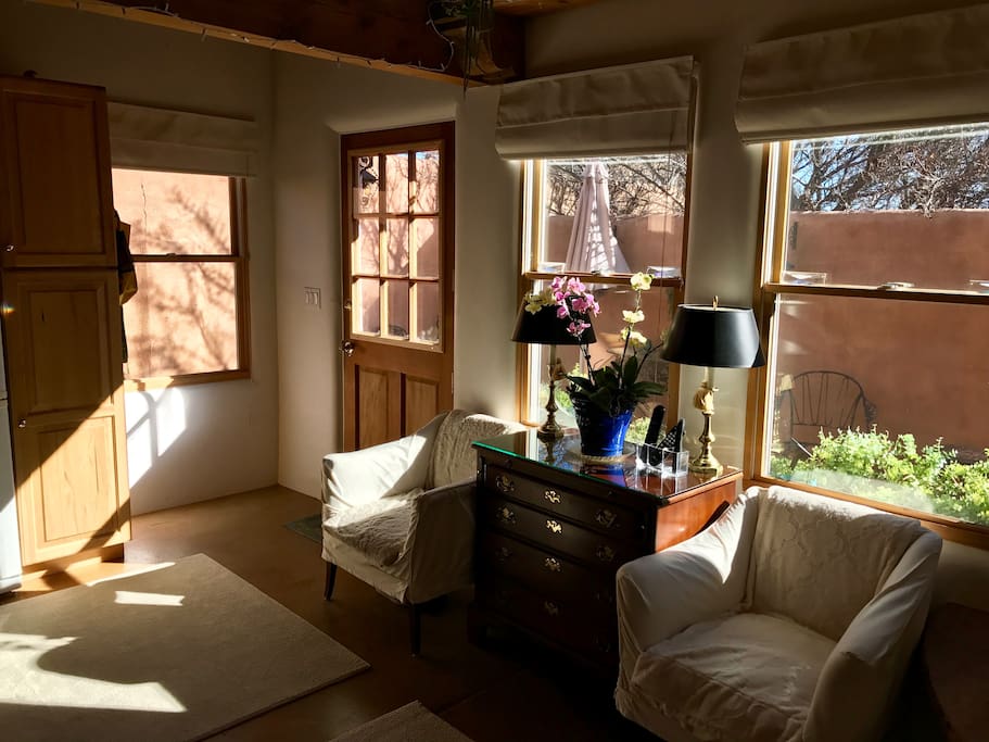 Sunny front room with cable TV.