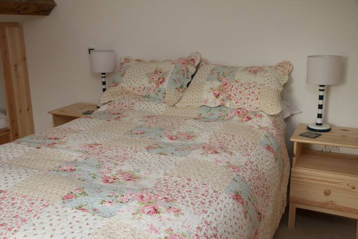 A double bed and 3 singles can be found in upstairs bedroom. We also have 2 foldway single beds if required for downstairs
