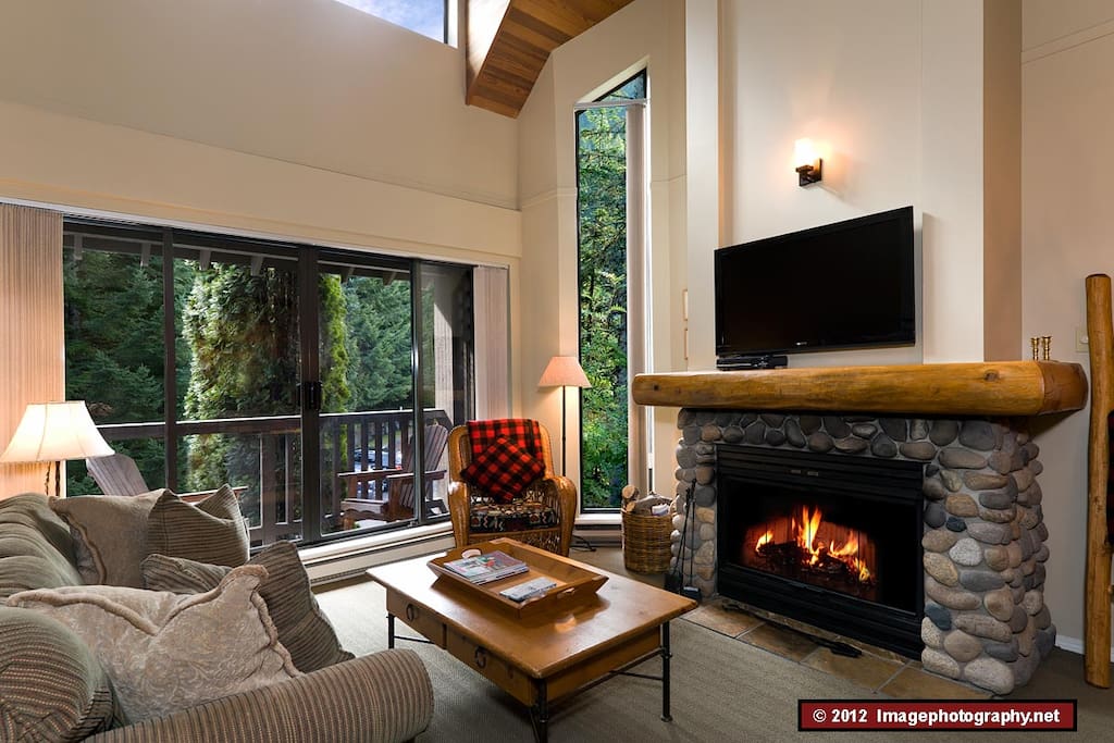 This is a view of the living room looking out to the balcony. This room contains a double sofa bed, which is suitable for 1 adult or 2 children.