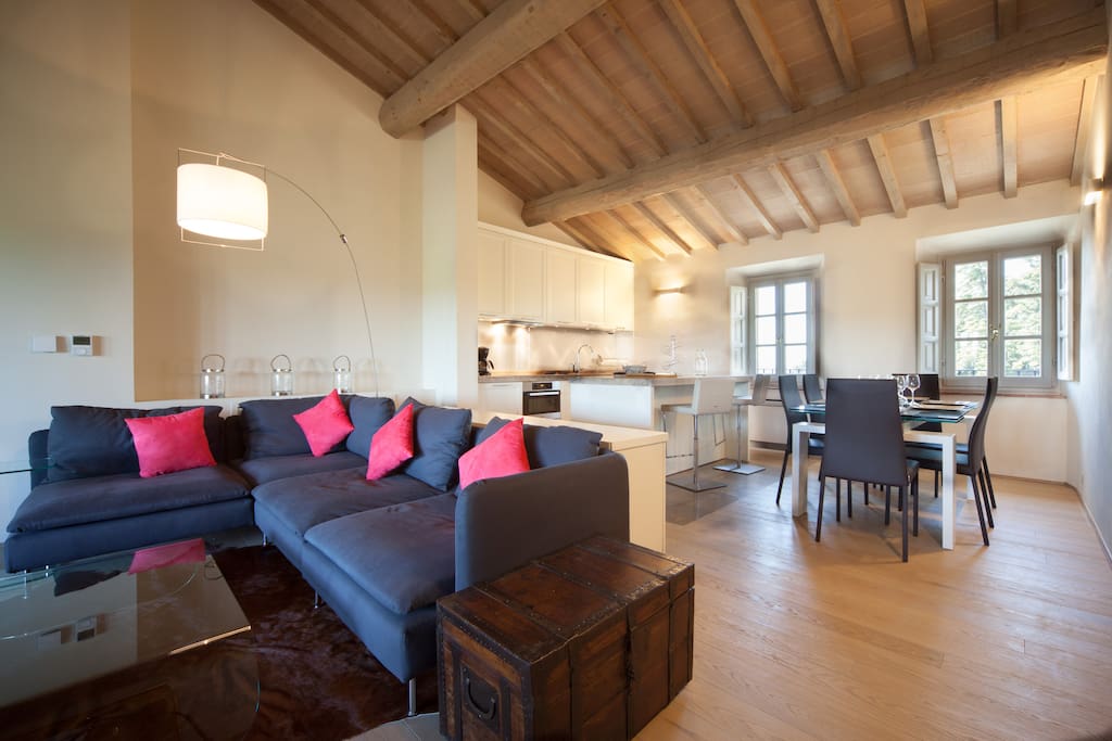Main living room with kitchen and dining areas beyond