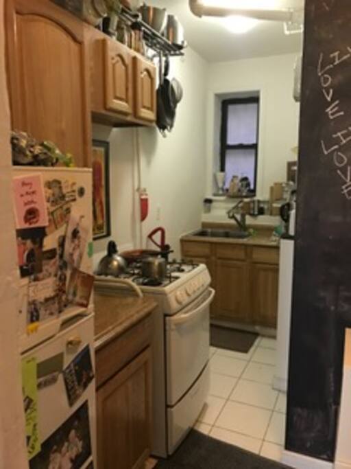 This is the kitchen! Fridge, stove, sink, and kitchen utensils feel free to use!