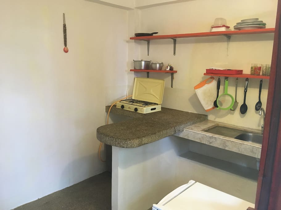Cute Kitchenette modestly equipped to serve 2 people. Mini Fridge with freezer, Gas stove. Tank lasts approx. 4 months and replacing costs about $3 including mototaxi ride.