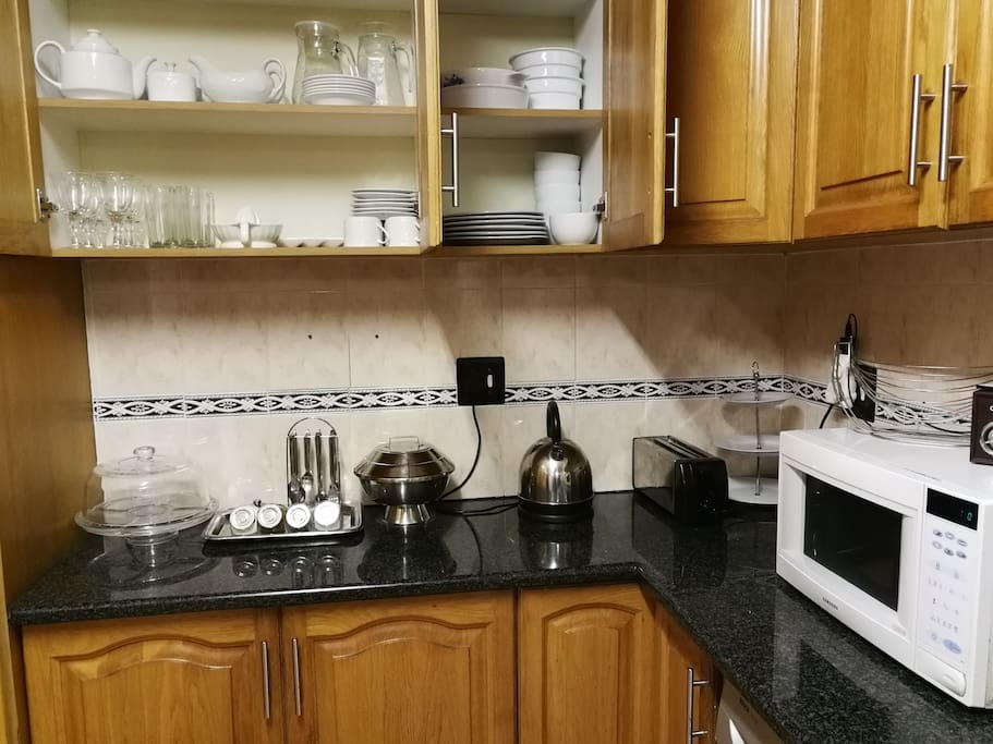 Shared kitchen space with basic amenities for 6 guests