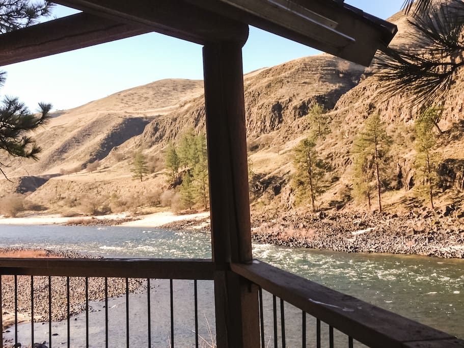View of the Front Deck which overhangs the Salmon River and a good private fishing hole.