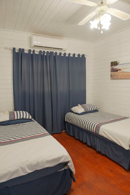 Bedroom with either 2 Single Beds or 1 Double Bed. Air Conditioned.