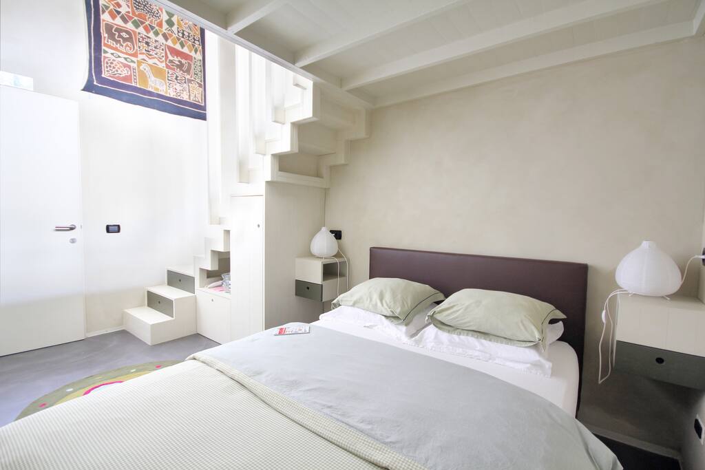 bed corner, under a cosy wooden roof