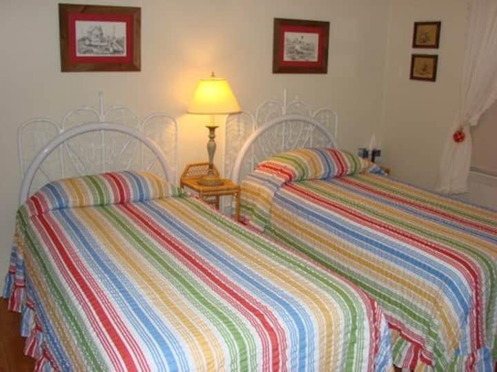 Cute, twin bedroom. All bedrooms have room darkening shades for those who like to sleep past sunrise.
