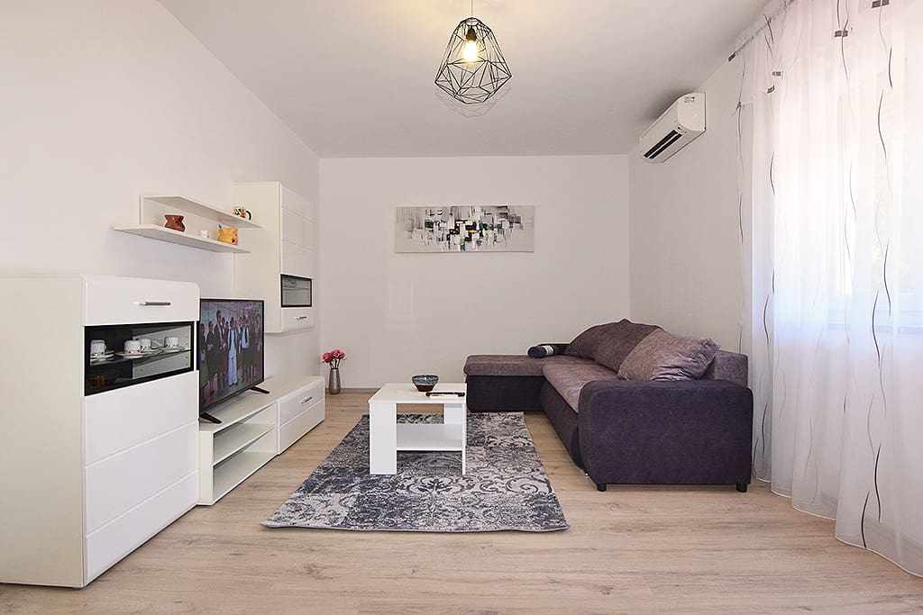 living room with sofa for extra person