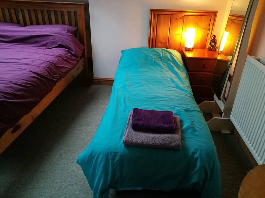 Our comfy fold down bed for a 3rd guest in the same room.