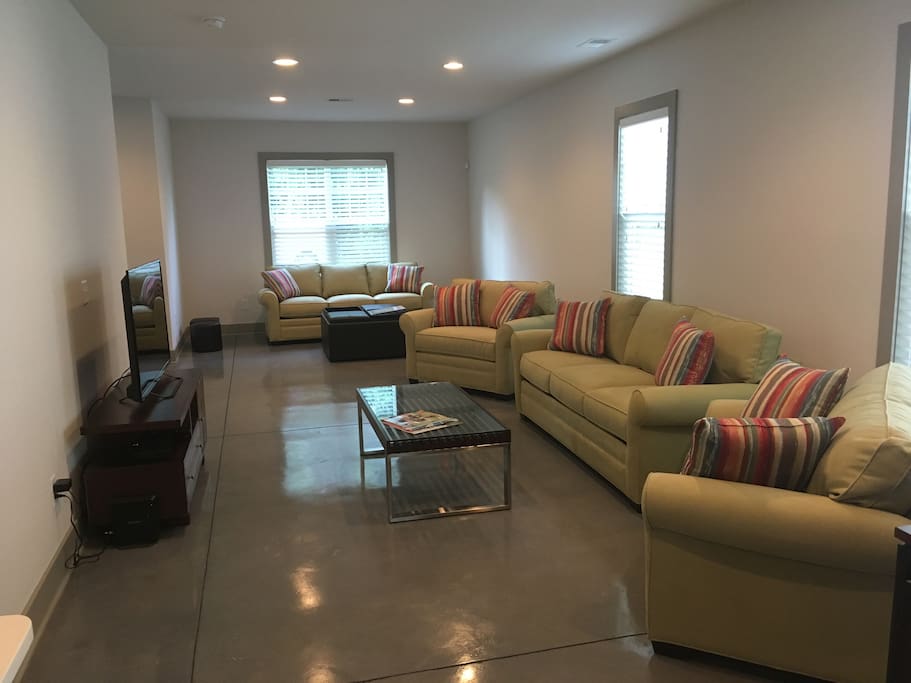 Huge living room kitchen and dining area with half bath on the first floor. 2 Queen size sofa beds and 2 comfy oversized chairs