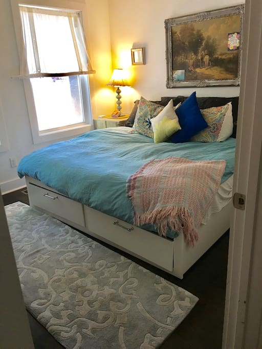 the twin bed(s) convert to a king bed with a feather topper, and down comforter with a duvet. It is super comfy! (see Ikea "Brimness" bed for specs)