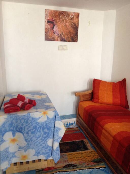 Couch in the room can be used as a sleeping place for a third person or a relaxing place to read or use wifi.