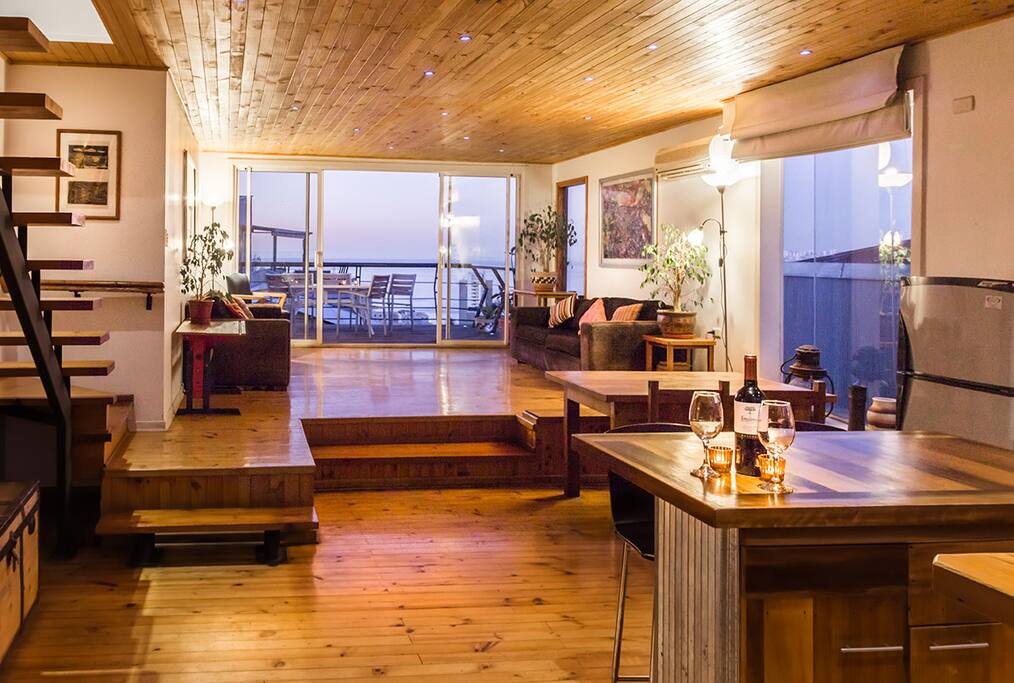 grand living and dining room with terrace