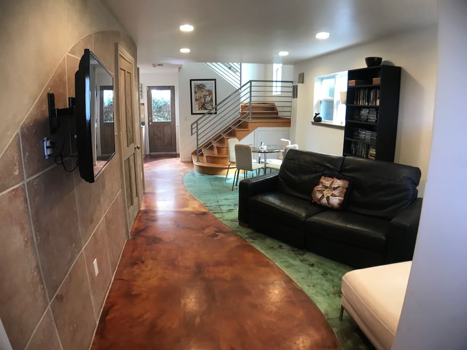 Dining area with kitchen and custom floor tile create the mood for family meals and parties!