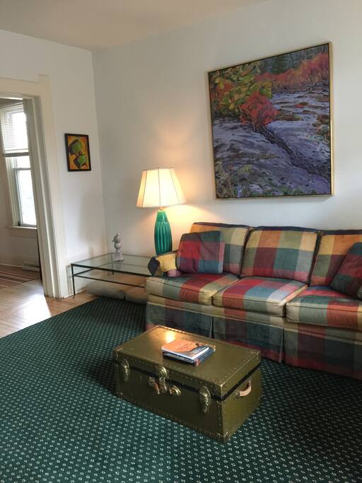 Bright Living Room with comfy full size sofa bed.