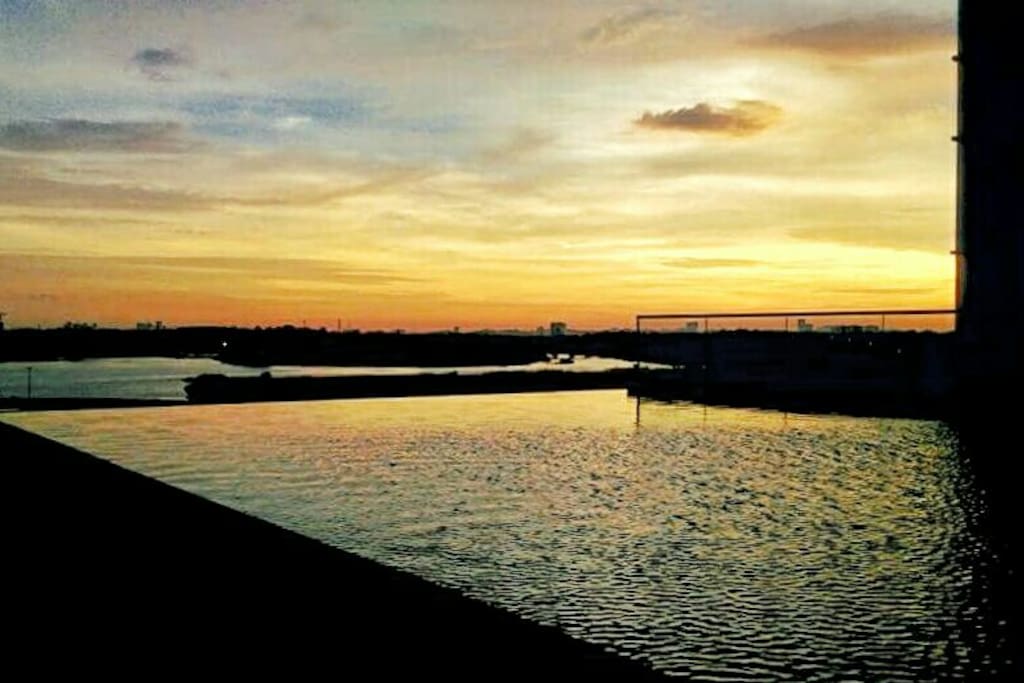 Luxuriate in the Infinity Pool that overlooks the sunset at sea of the Straits of Johor.