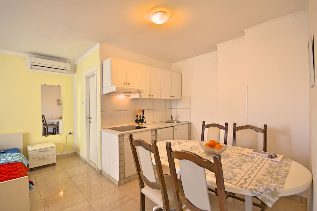Kitchen with room and eating area