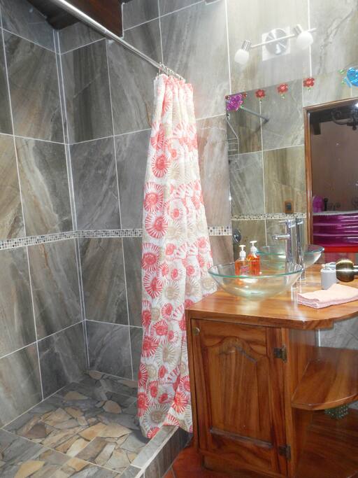 This large bathroom has HOT water and great water pressure.