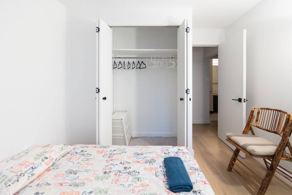 Huge closet with hangers, convenient access to the bathroom