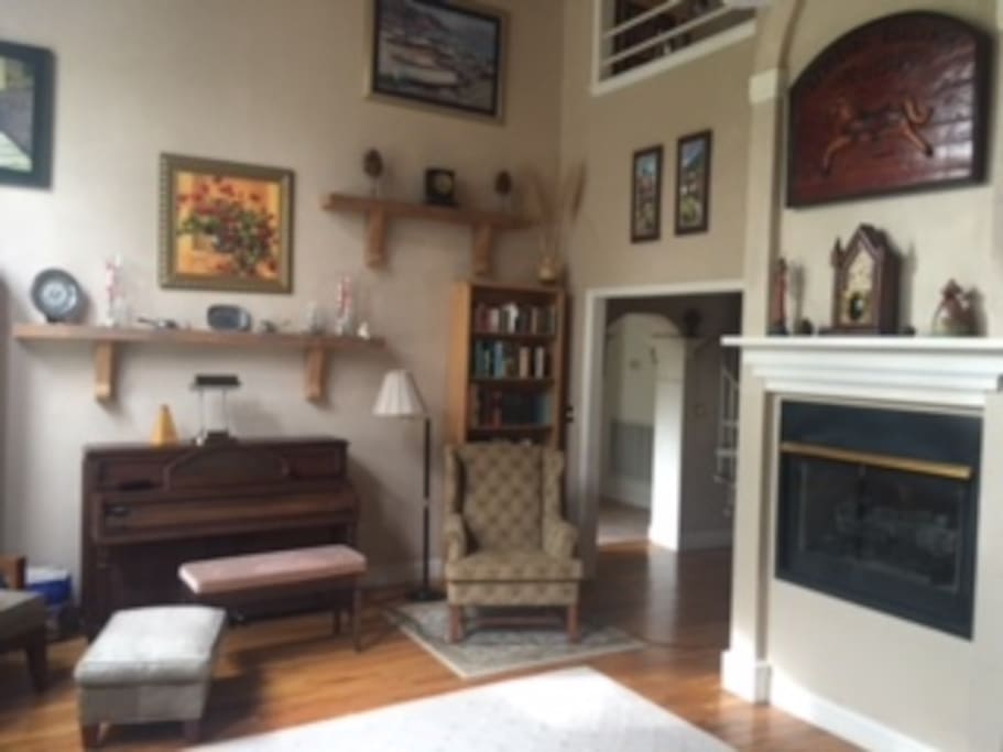 Living room with fireplace and cathedral ceiling