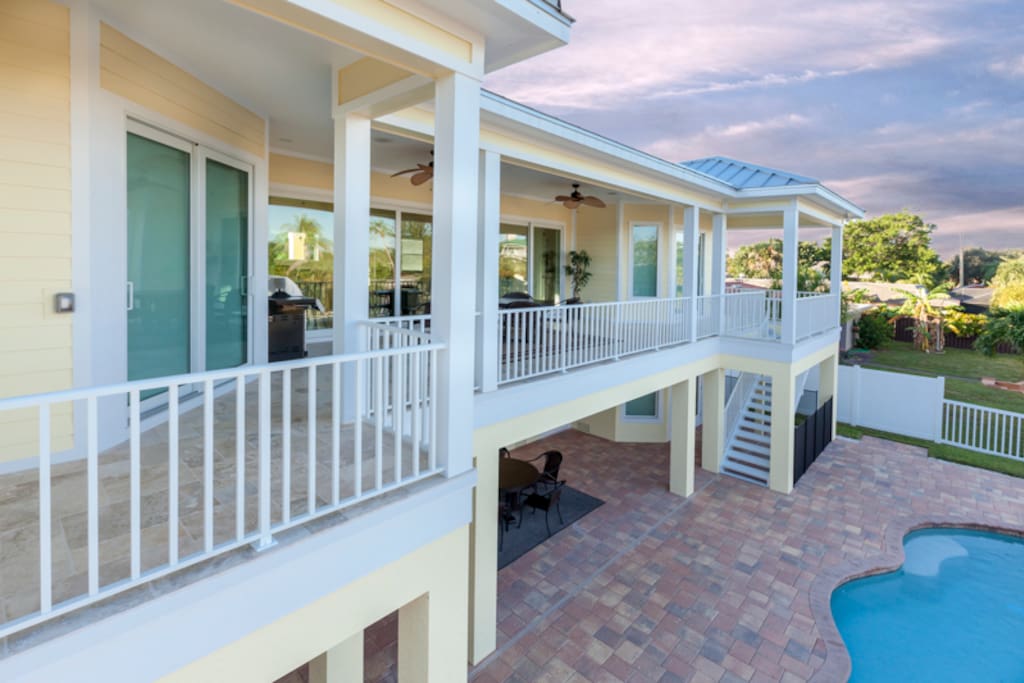 Enjoy serene canal and pool views from your covered porch
